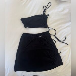 Two piece black top with black skirt